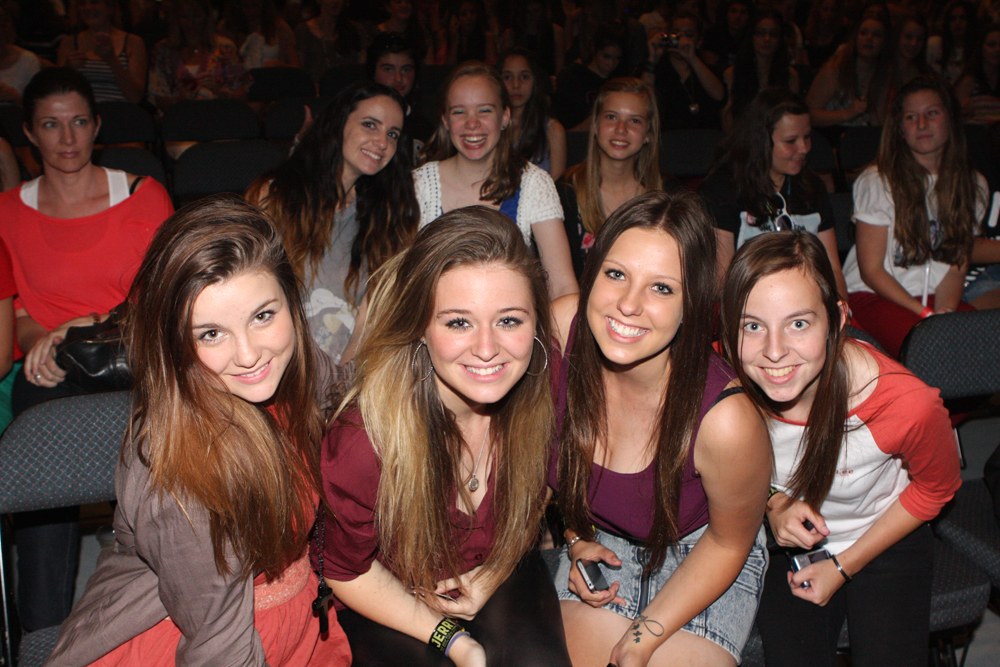 These teens are at a concert together.^[[Image](https://www.flickr.com/photos/evarinaldiphotography/6927134950) by [Eva Rinaldi](https://www.flickr.com/photos/evarinaldiphotography/) is licensed under [CC BY-SA 2.0](https://creativecommons.org/licenses/by-sa/2.0/)]