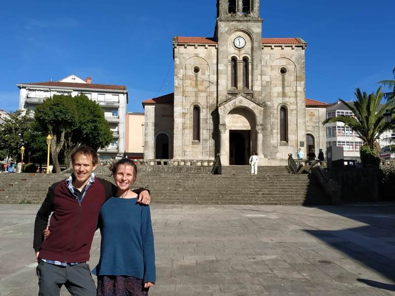 Enjoying the sunshine and a chance to rest our feet outside the church in the Plaza Mayor of Lalin.